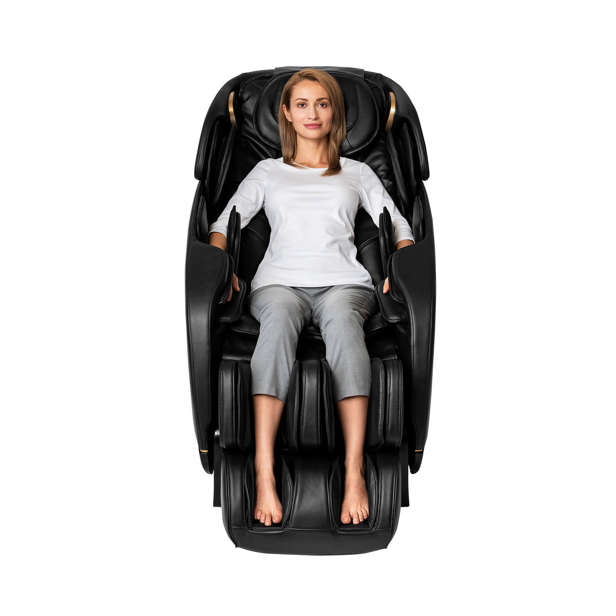 Person relaxing in a black leather Inner Balance Wellness Jin 2.0 Massage Chair