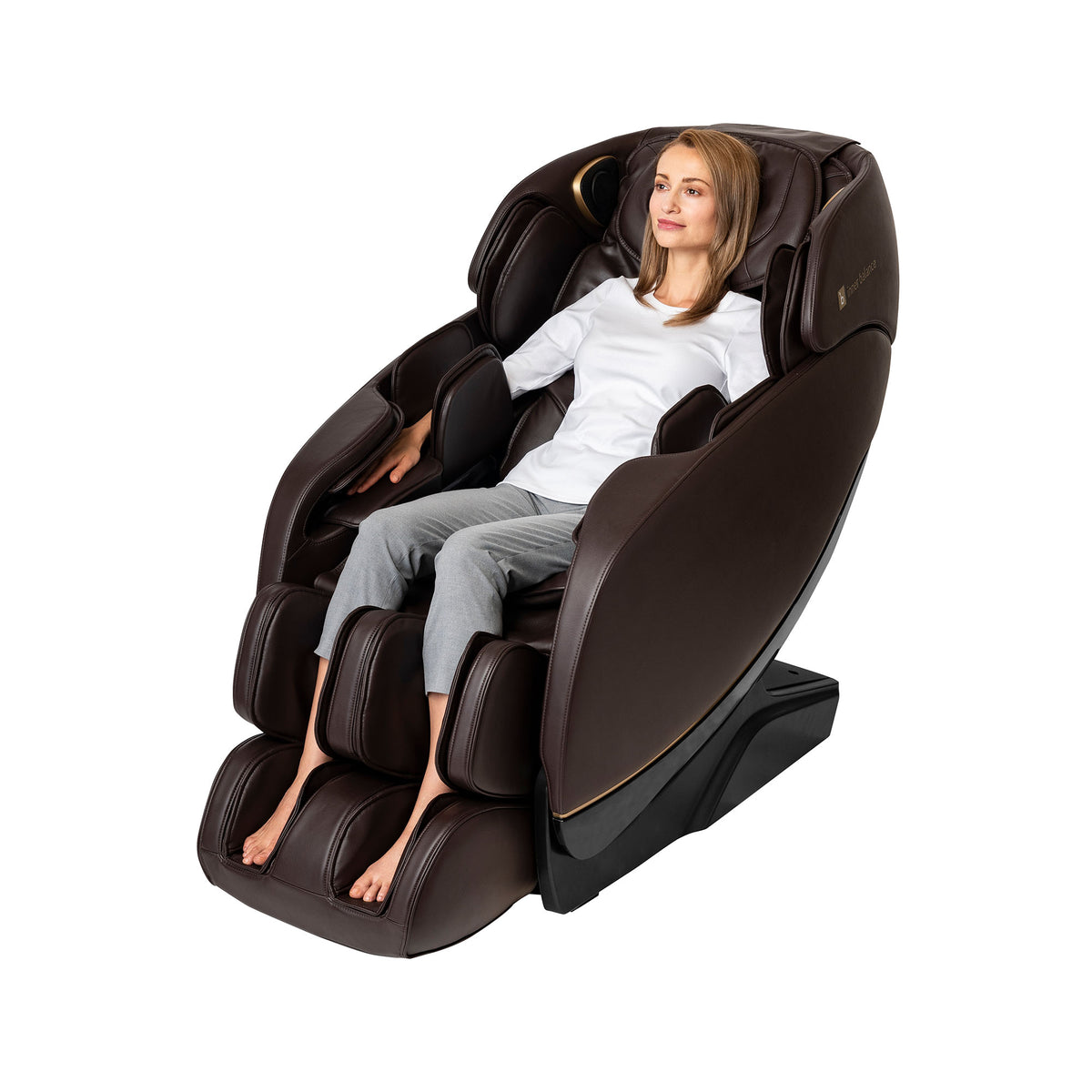 Individual using the brown leather Inner Balance Wellness Jin 2.0 Massage Chair for relaxation
