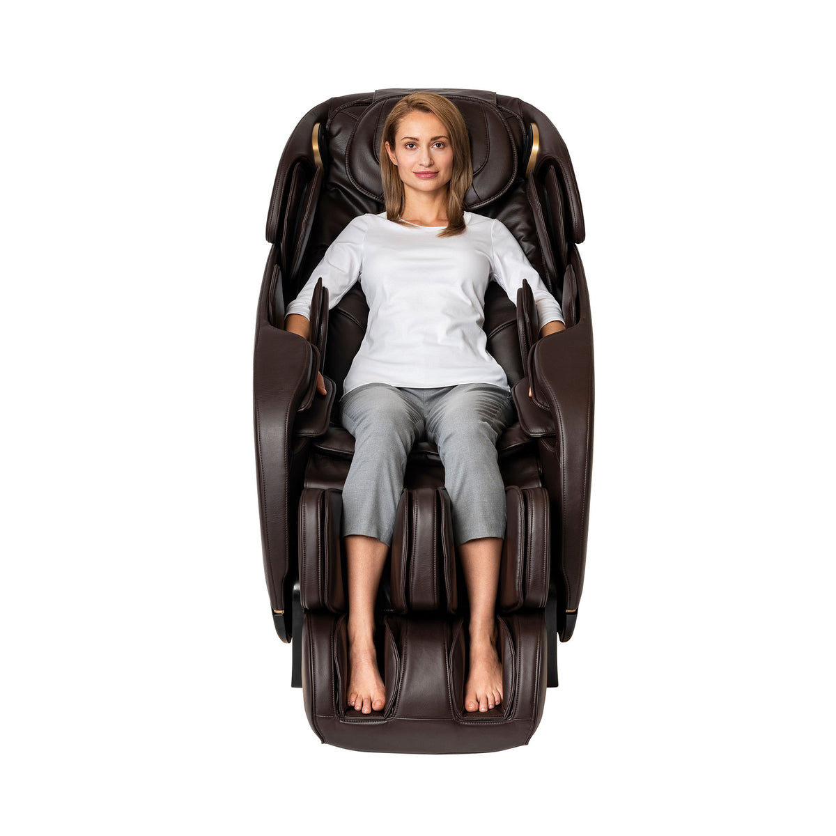 A woman relaxing in a brown leather Inner Balance Wellness Jin 2.0 Massage Chair
